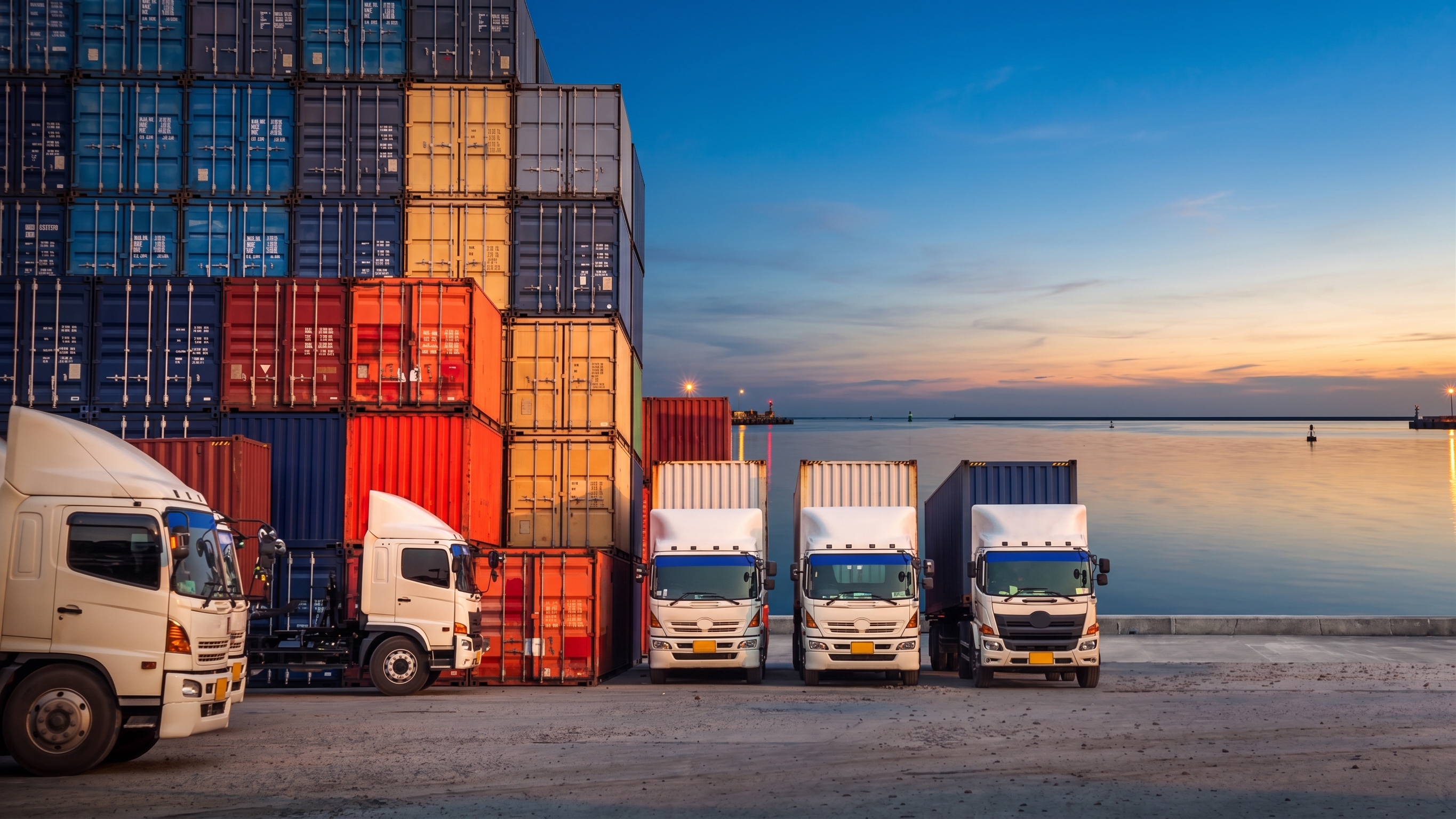 Logistics trucks, shipping containers and cargo aircraft